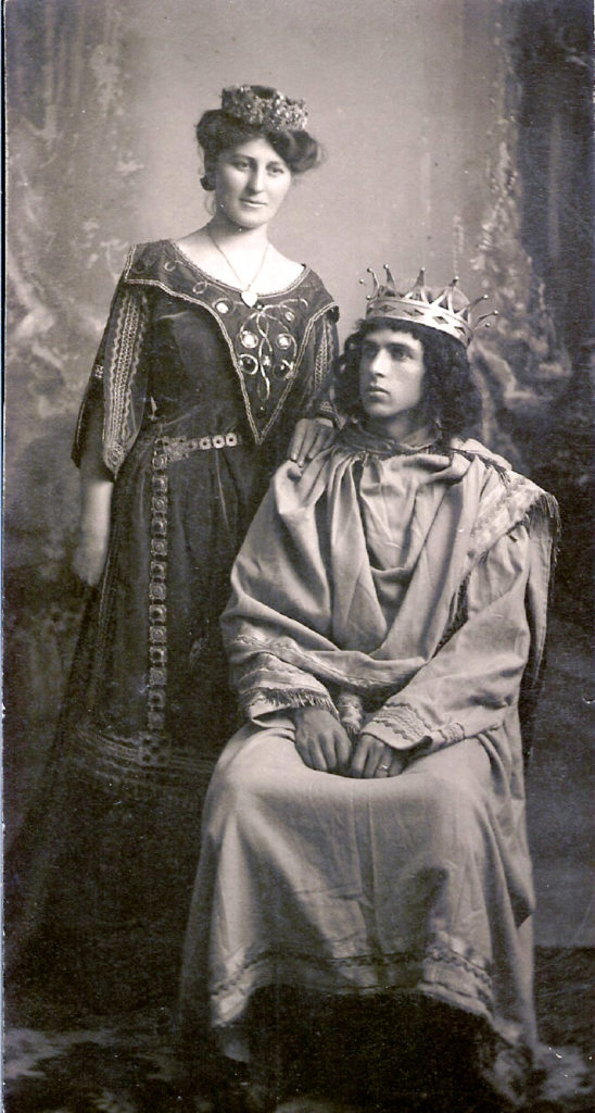 Couple in king and queen costumes.