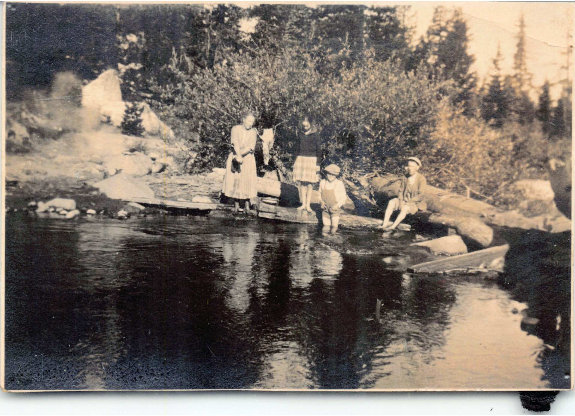Family wading by a river